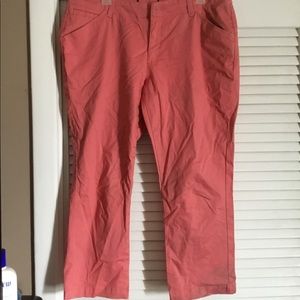 Coral color crop pants.